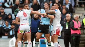 The Sharks, led by Nicho Hynes (centre) proved too good for the ill-disciplined Dragons on Sunday afternoon. Picture Getty Images