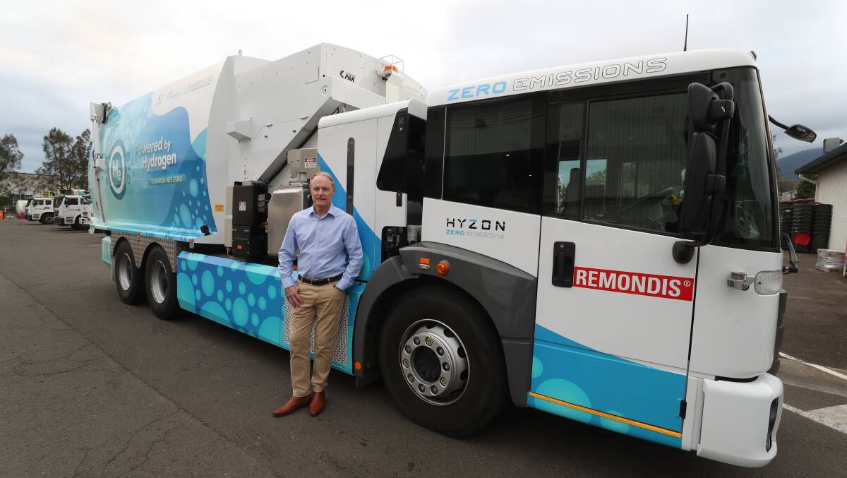 Chris Wade, regional manager at Remondis, and the hydrogen-powered garbage truck that has been picking up bins throughout the Illawarra. Picture by Robert Peet