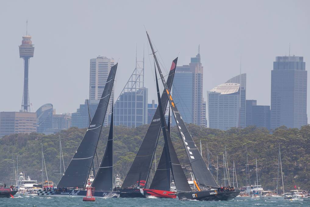 Journey south: InfoTrack (right), Comanche (centre), Black Jack (left) at the star of last year's Sydney to Hobart race. After Comanche's withdrawal, InfoTrack and Black Jack are the favourites for the race starting on Boxing Day. Picture: Steve Christo/Corbis via Getty Images