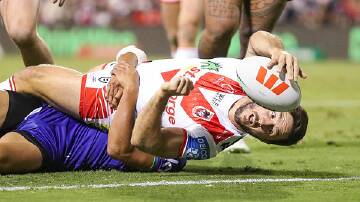 Ben Hunt reached out to score the Dragons third try in St George Illawarra's 30-12 win over New Zealand Warriors on Friday night at WIN Stadium. Picture by Adam McLean