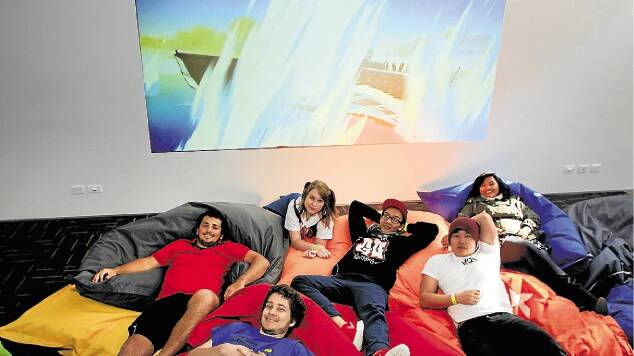 Social event: Gamefest attendees, from left, Matthew Theris, Jarrod Simpson, Kayla Hungerford, Bubbles Phan, Daniel Li and Ayu Saraswati take a break in the manga movie room at UOW. Picture: ANDY ZAKELI