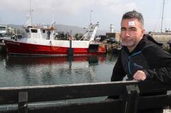 Frank Musumeci and his fishing trawler Mis Perception. Mr Musumeci fears commercial fishing will be wiped out if the Illawarra offshore wind farm goes ahead. Picture by Robert Peet