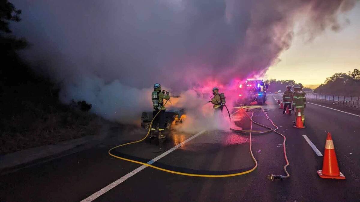 Fire crews respond to a car fire on the Princes Highway earlier this morning. Picture supplied Broughton Vale - Berry RFB and Gerringong RFB