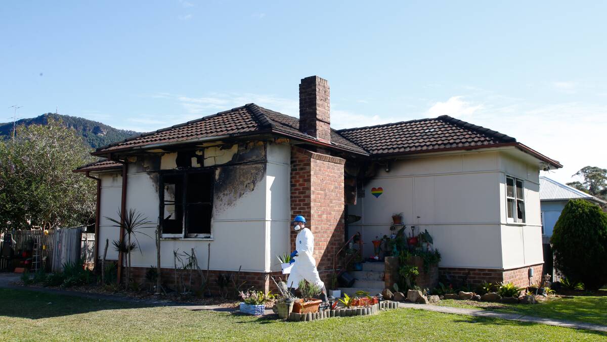 Investigators continue to scour the home for a cause on Sunday morning. Picture by Anna Warr