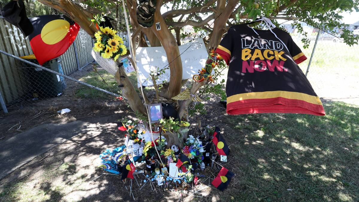 A memorial set up for the dead Bellambi boy after he was killed in a crash in Towradgi. Picture by Robert Peet