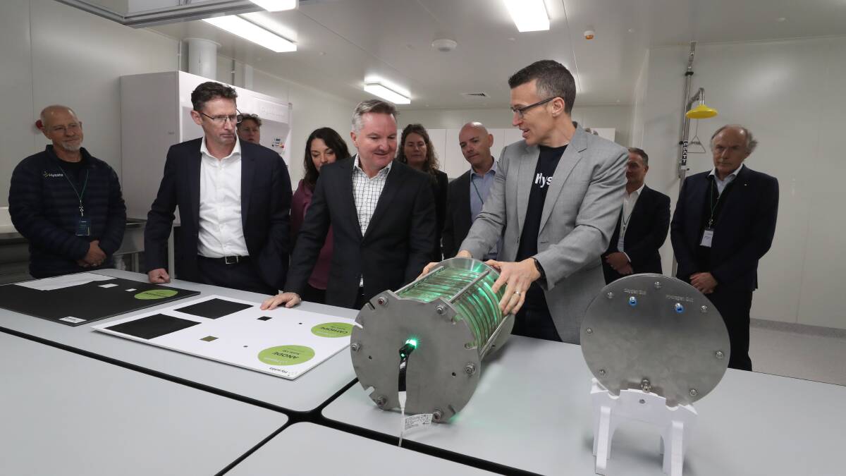 Hysata CEO Paul Barrett presents the company's electrolyser to energy and climate change minister Chris Bowen. Picture by Robert Peet