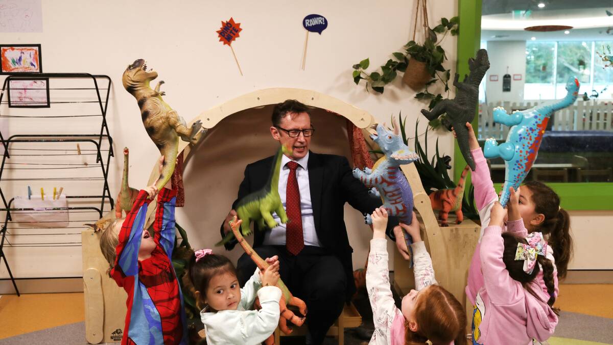 Stephen Jones with preschoolers at Big Fat Smile Shellharbour. Early childhood educators and aged care workers will receive pay rises after funding was confirmed in this year's budget. Picture by Sylvia Liber