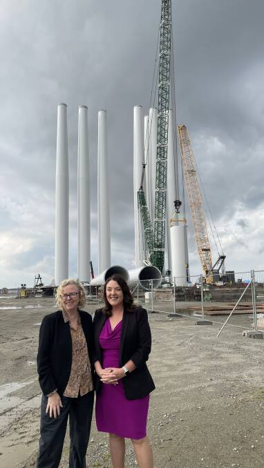 Sharon Claydon and Alison Byrnes at the Port of Esbjerg with a wind turbine tower assembled in the background. Picture by Connor Pearce