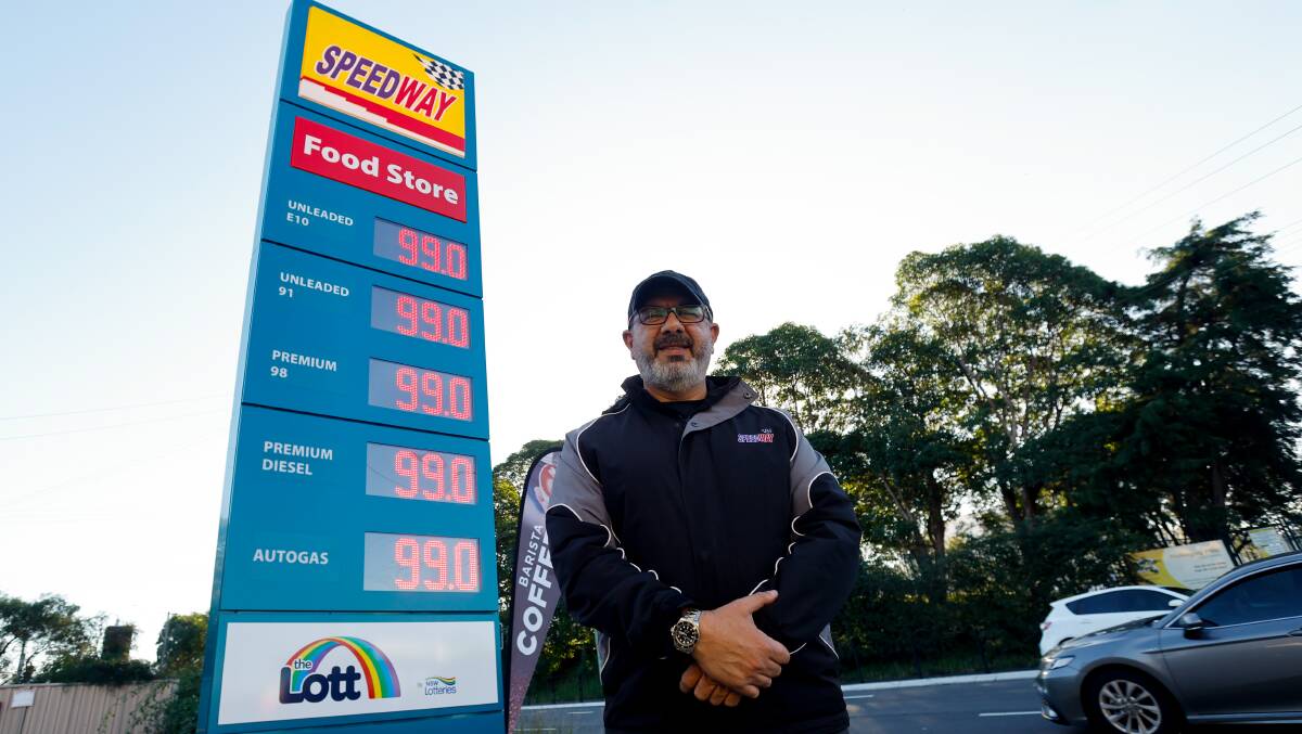 Sid Saliba outside the Speedway service station on Crown Street which also discounted its petrol to 99 cents. Picture by Anna Warr