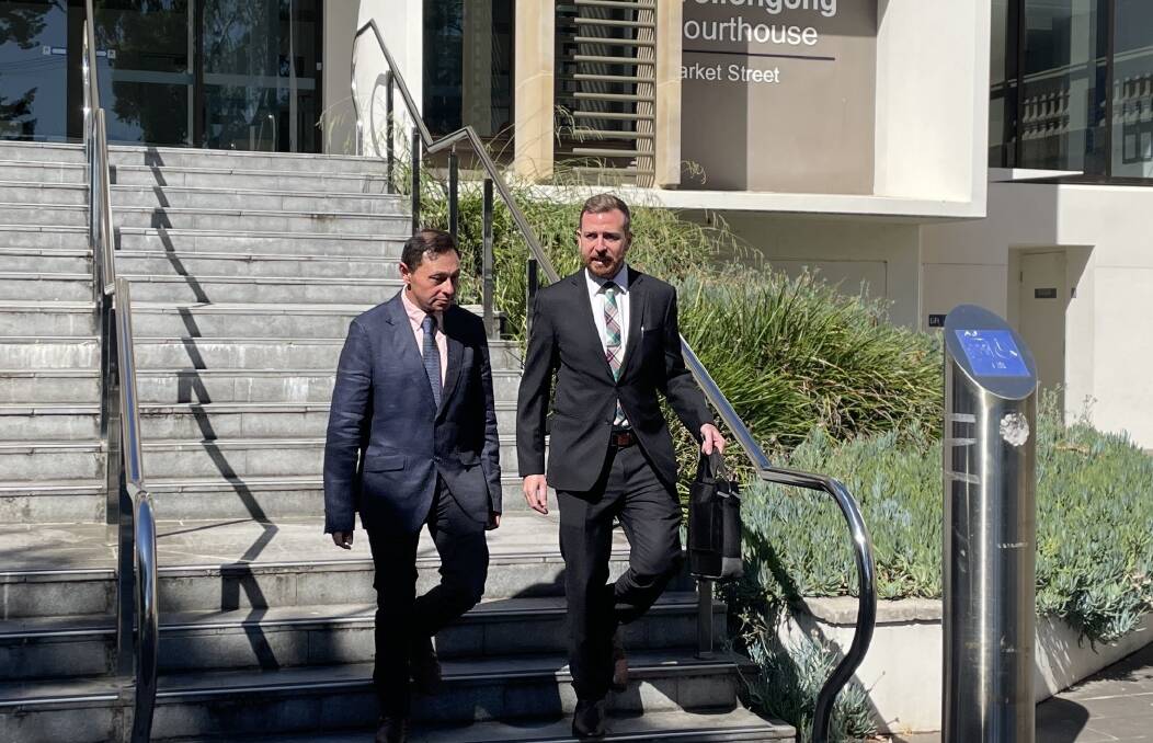 Brendon Comber (left) leaves Wollongong Courthouse with his lawyer.