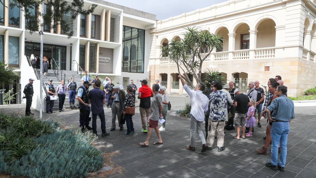 A group of supporters outside Wollongong courthouse after a magistrate directed them to leave on January 23. Police officers barricaded the entry, while Colin Robert Dunque was still inside, allegedly refusing to leave. Picture by ACM