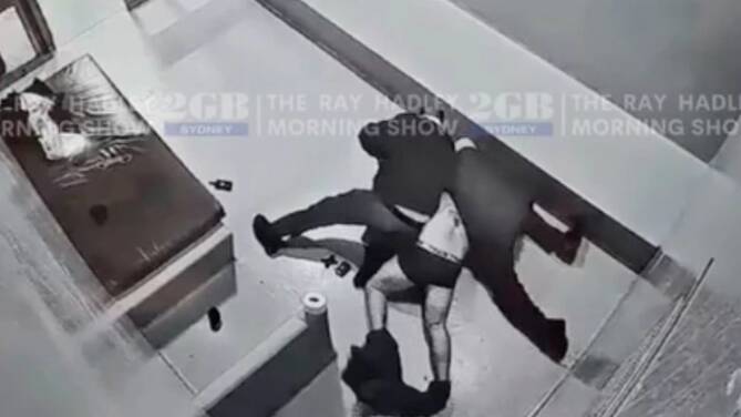 A still from CCTV footage showing David Huynh being tackled in a police cell in July 2023. Picture from 2GB