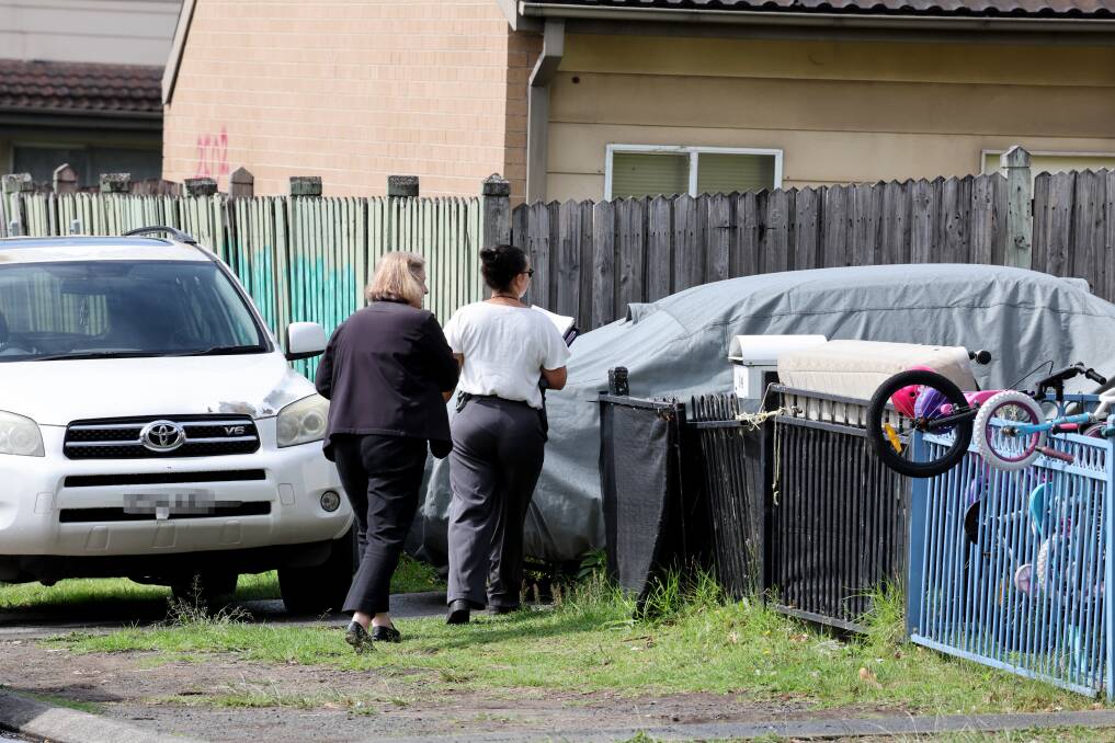 Detectives door knocking on November 23, the night after Kristie Mcbride was allegedly stabbed. Picture by Sylvia Liber