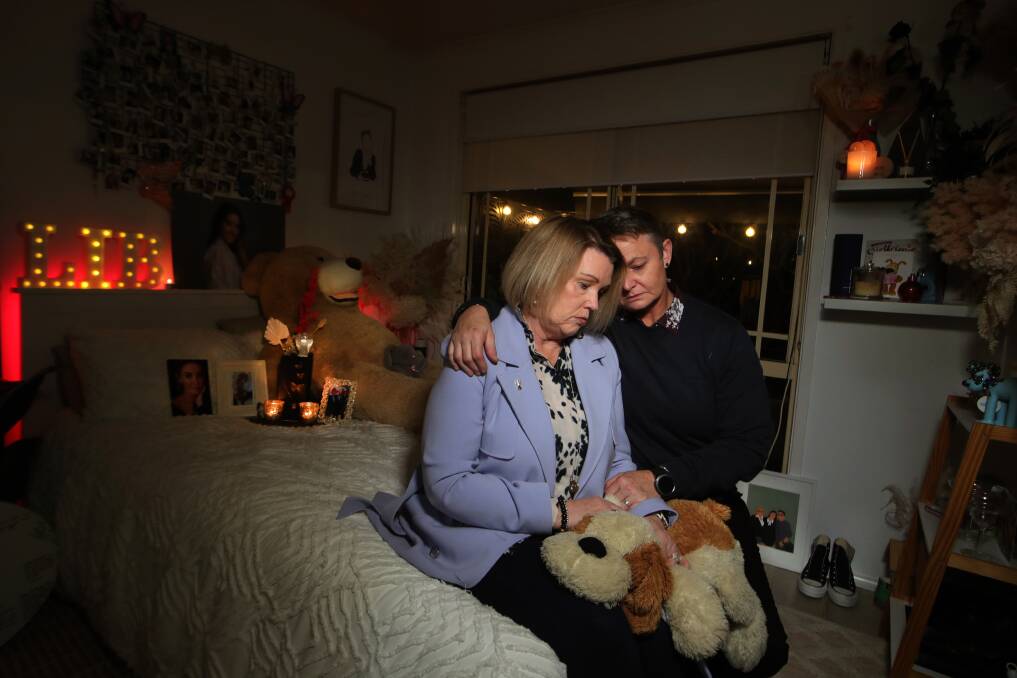 Grieving mothers Julie Ruge and Julie Harrison in Libby's untouched bedroom in May this year. Picture by Sylvia Liber.

