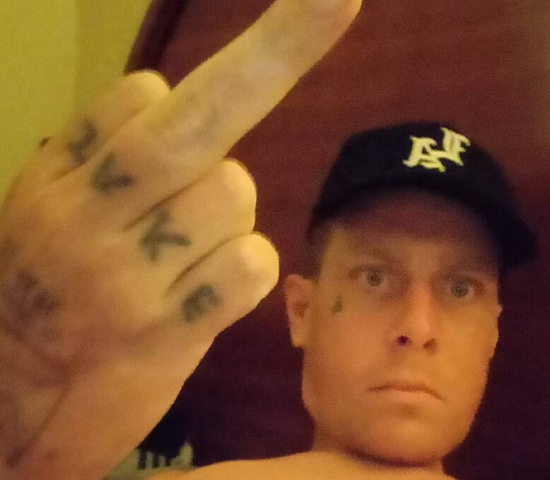Jake Gerald Platt in a social media selfie showing 'JAKE' tattooed on his knuckles. Picture from Facebook