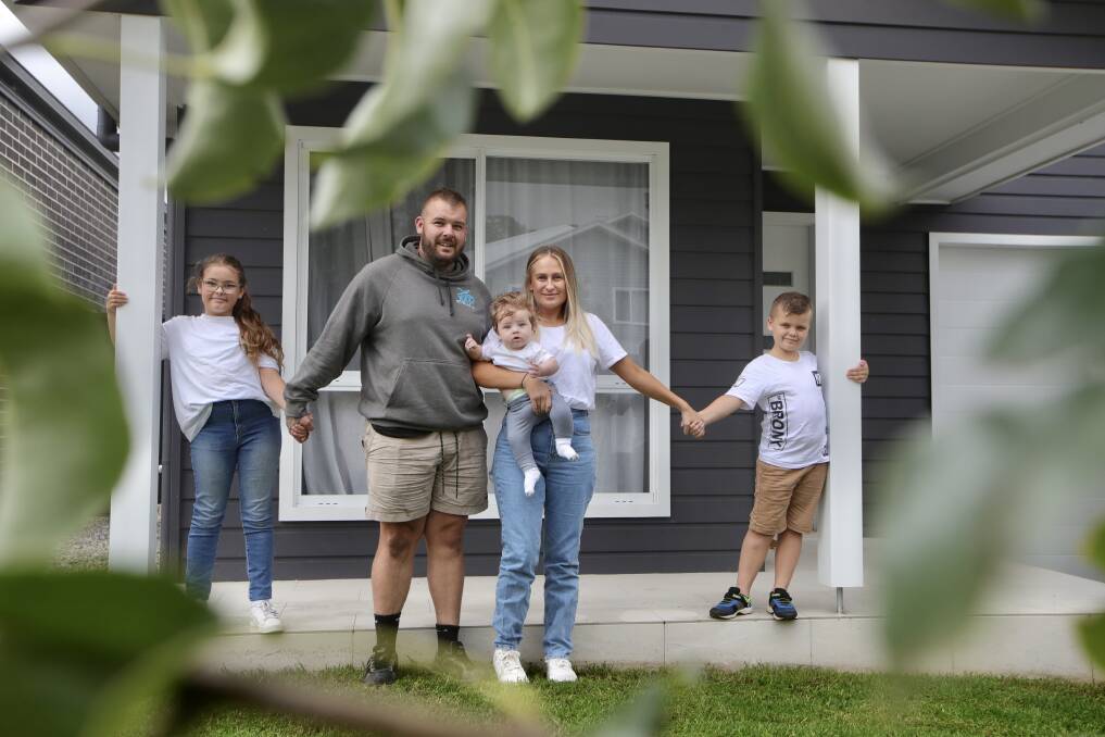 Population boom: John and Allie Hermann with their kids Riley, Banks and Ryder. The family moved to the fast-growing Albion Park area last year, and haven't looked back. Picture: Sylvia Liber