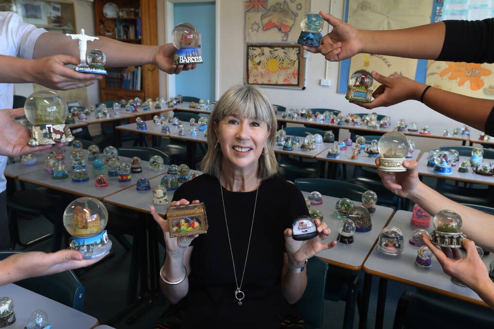 Retiring Smith's Hill High School teacher Kerry-Lee Doyle with her collection of snow globes. Picture: Robert Peet