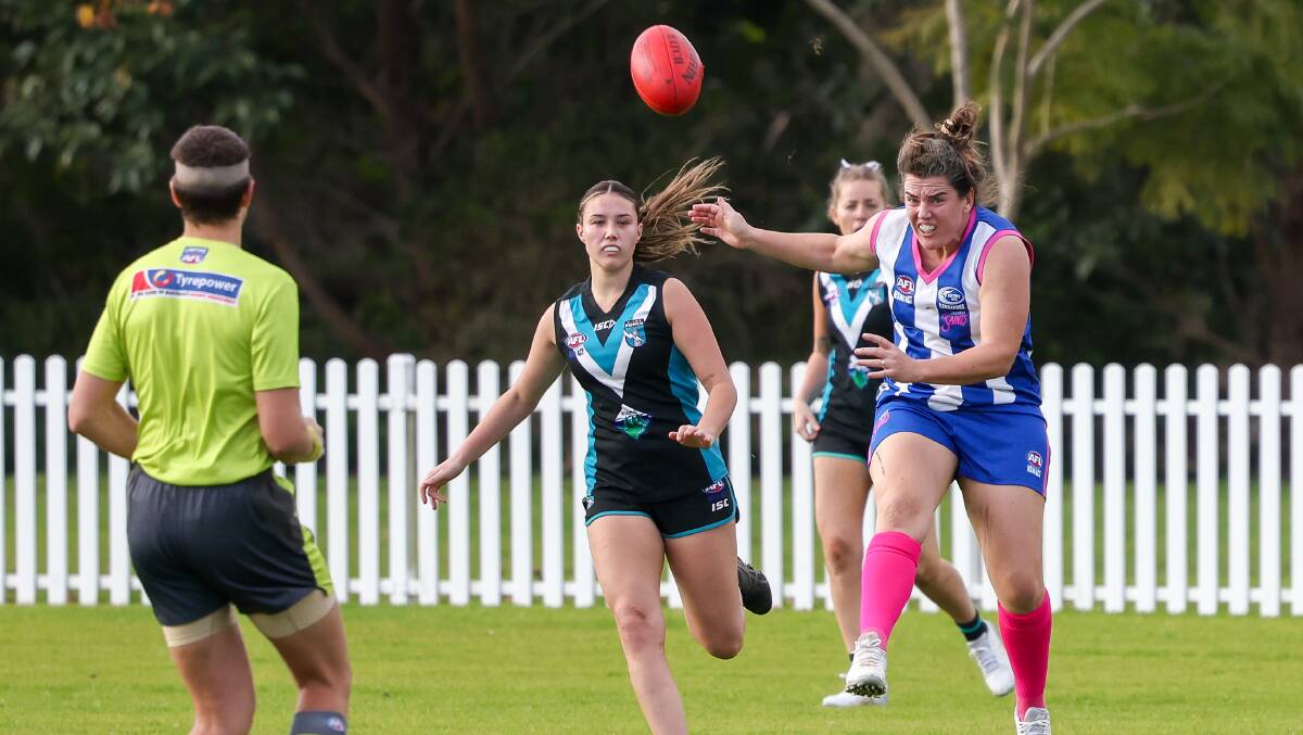 Kat Gow kicks through the ball in her milestone 200th game for Figtree Saints against Kiama in AFL South Coast. Picture by Adam McLean