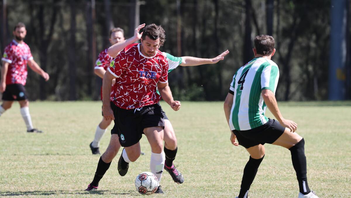 Bojan Caric netted as Oak Flats defeated Warilla go to top of the District League ladder. Picture by Sylvia Liber