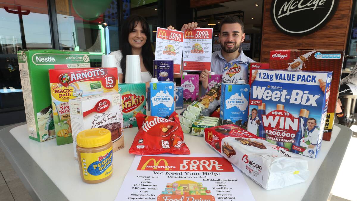 Sharnae and James Dwarte are organising a food drive at McDonald's Warilla. Picture by Robert Peet.