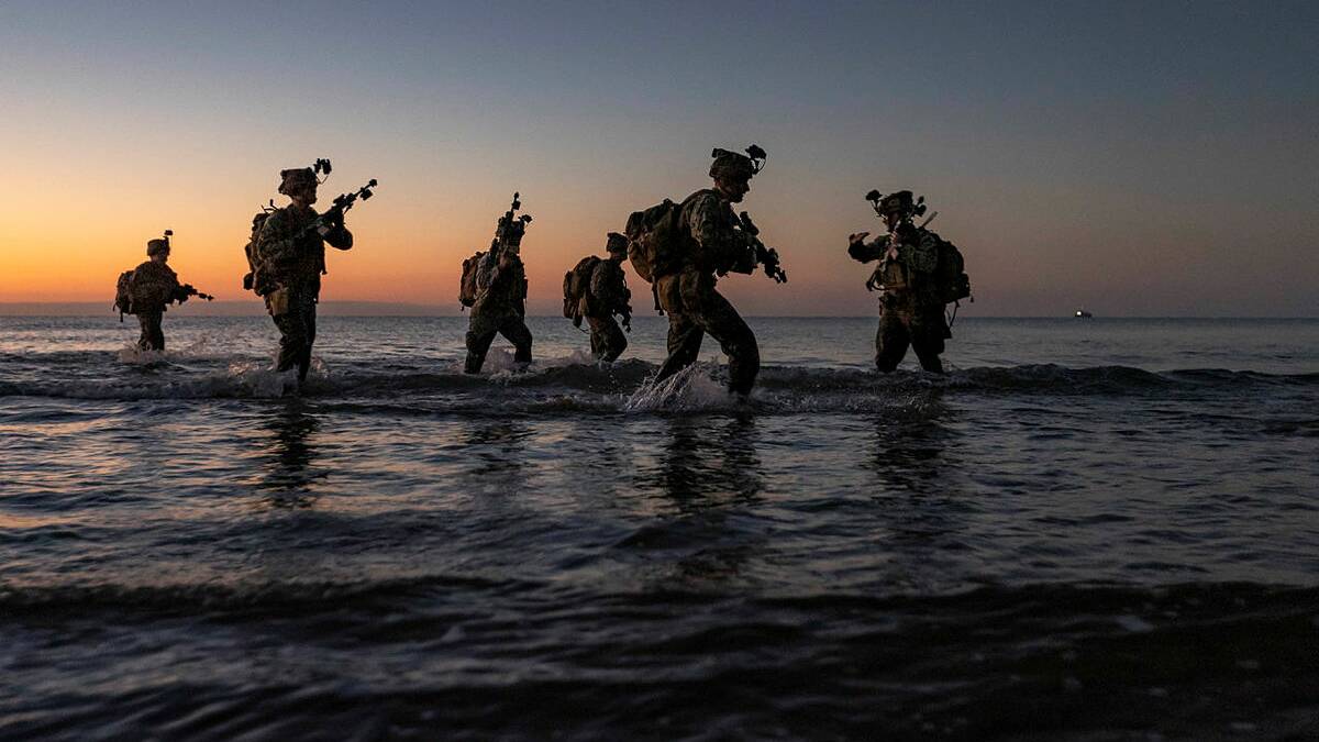 United States Marines from the 1st Battalion, 7th Marines, land on Forrest Beach, Queensland, as part of an amphibious assault activity during an earlier Exercise Talisman Sabre. Picture by Corporal Jarrod McAneney.