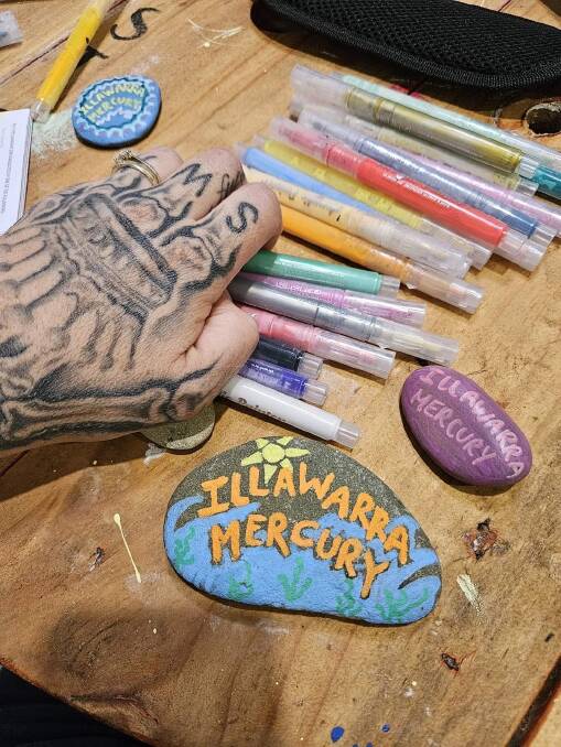 Alena Cormack painted some pebbles with the words 'Illawarra Mercury' ahead of her interview. Picture supplied by Alena Cormack