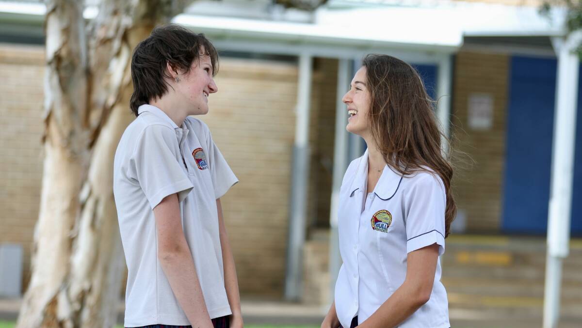 Bulli High School year 12 students Lani Taylor and Rose Youshiphshare a laugh after their first HSC exam on October 11. Picture by Adam McLean
