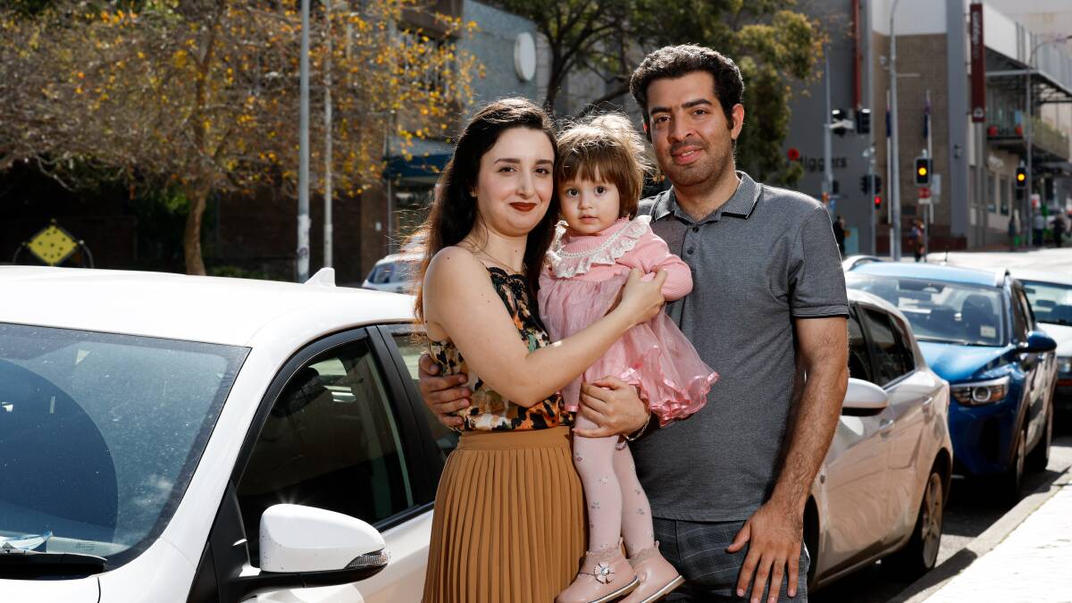 Mahnaz Darabi, 18-month-old daughter Regina Taslimi, and Esmaeil Taslimi. The couple both obtained their driver's licence through an Illawarra program supporting refugees and migrants. Picture by Anna Warr