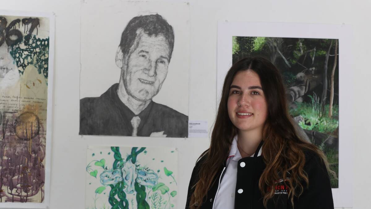 Albion Park High School student Grace Lozenkovski at Project Contemporary Artspace with her artwork 'Granddad' ahead of the exhibition Every Artist Was First An Amateur. Picture by Robert Peet