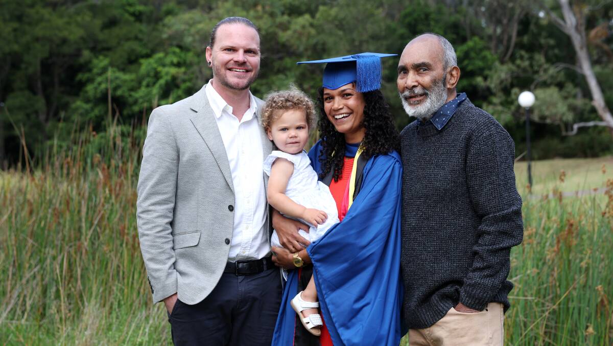 UOW graduate Janaya Pender with her partner Reece McDonald, daughter Odette McDonald and father Eddie Pender. Picture by Sylvia Liber