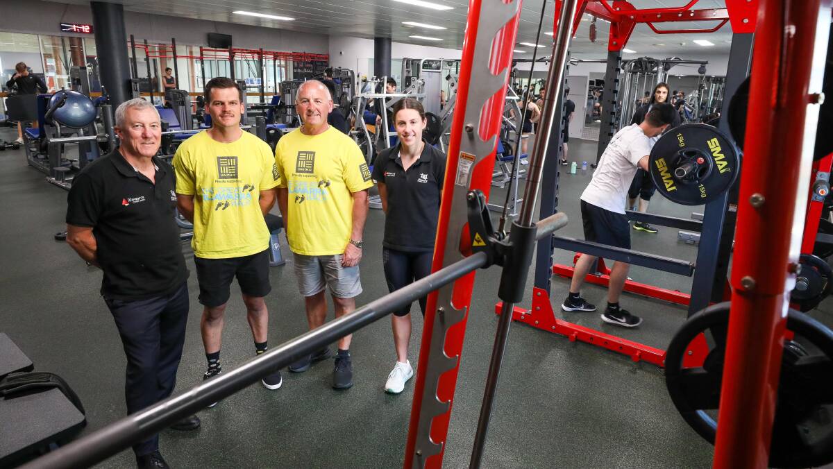 John Armstrong CEO of Illawarra Academy of Sport, Christian Lovatt and Chris Lovatt from the Great Illawarra Walk and Emily Robinson from Illawarra Academy of Sport at the University of Wollongong gym. The two groups raised money to build a purpose built gym for young athletes living with a disability. Picture by Adam McLean.