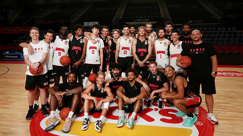 Illawarra Hawks players pose for a team photo with coach Justin Tatum. Picture by Sylvia Liber. 
