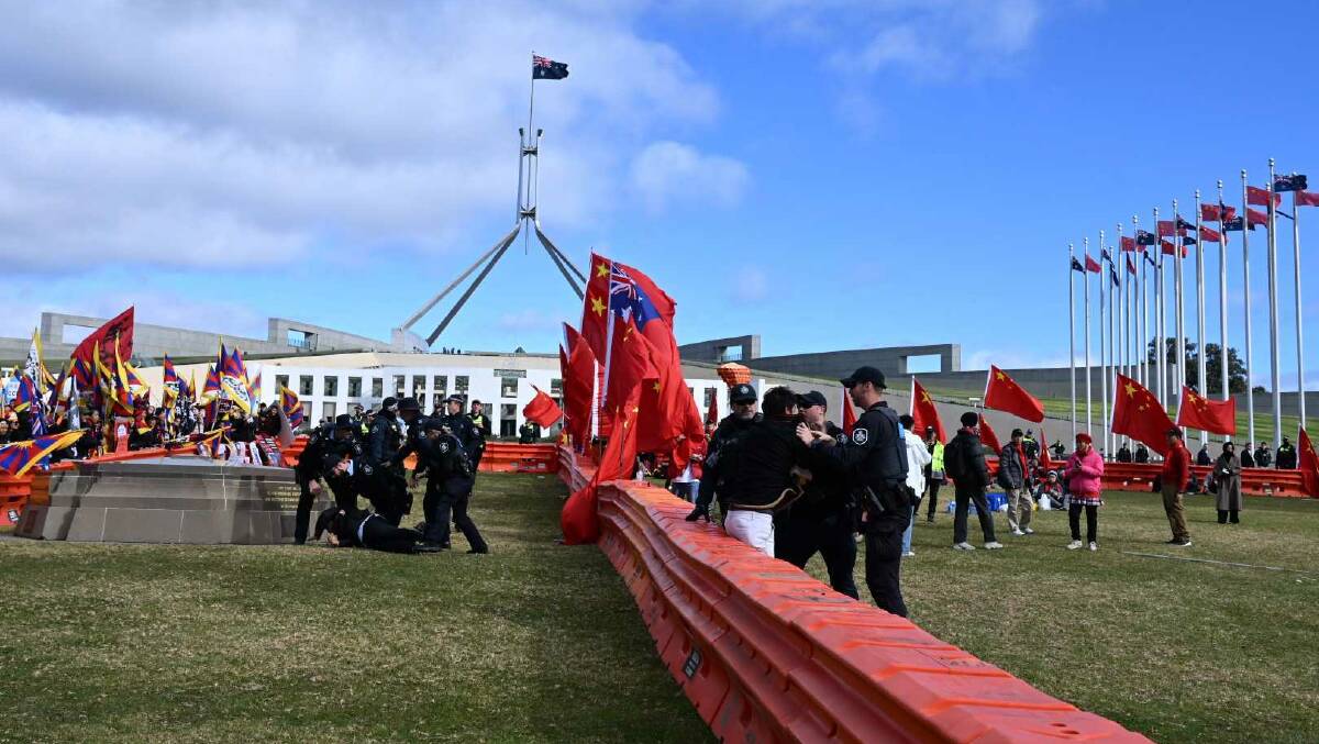 Police respond to protesters at Parliament House on Monday. Picture by Elesa Kurtz