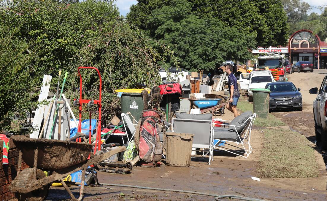 The clean-up in Arrow Avenue, Figtree, after the April storms. More than 3000 tonnes of waste was collected in kerbside pick-ups by Wollongong City Council. Picture by Robert Peet