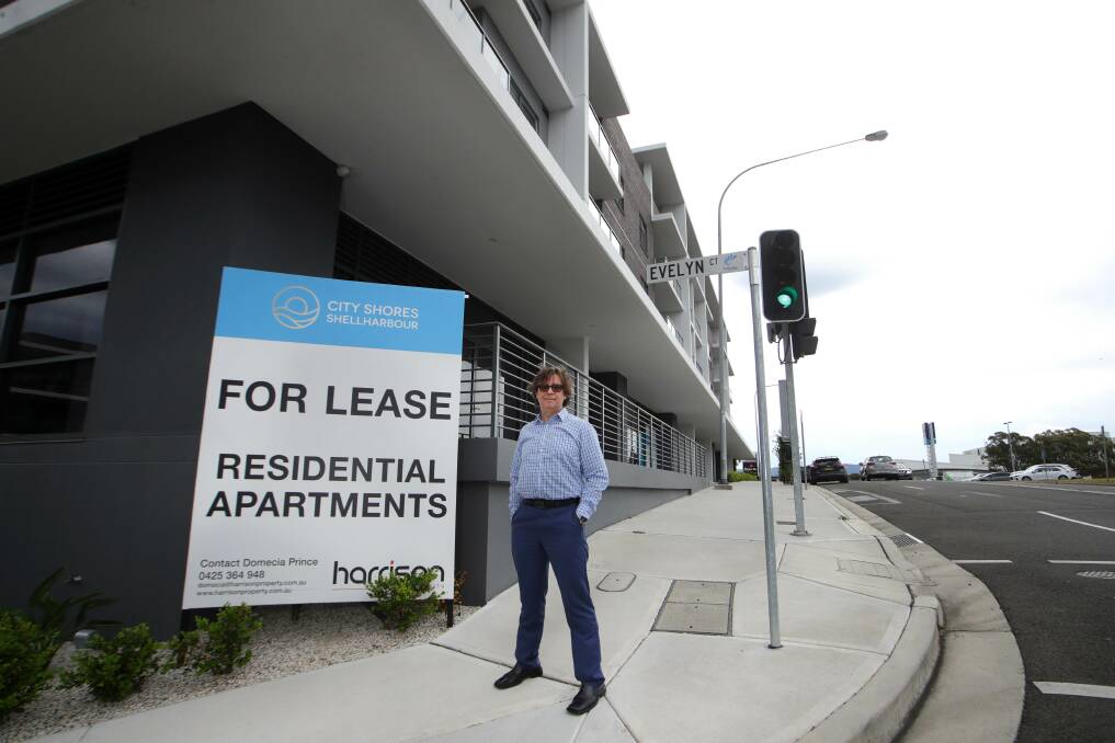 Sasho Klimevski outside the City Shores Shellharbour apartment complex, where he bought an apartment for his parents in 2019, but they still have not been able to move in. Picture by Sylvia Liber