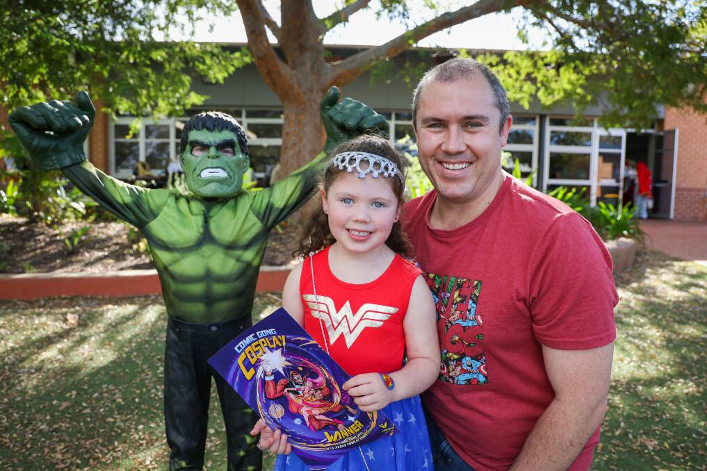 Chloe Boncompagni won the 3-5 year-olds best dressed competition with her Wonder Woman outfit much to the joy of The Hulk (aka brother Will) and dad Trent. Picture by Wesley Lonergan