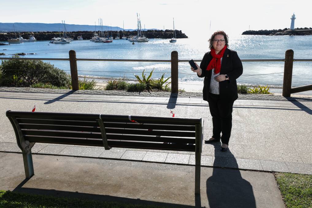 Tech: Wollongong city councillor Tania Brown with a park bench that could one day charge a mobile phone. Picture: Adam McLean