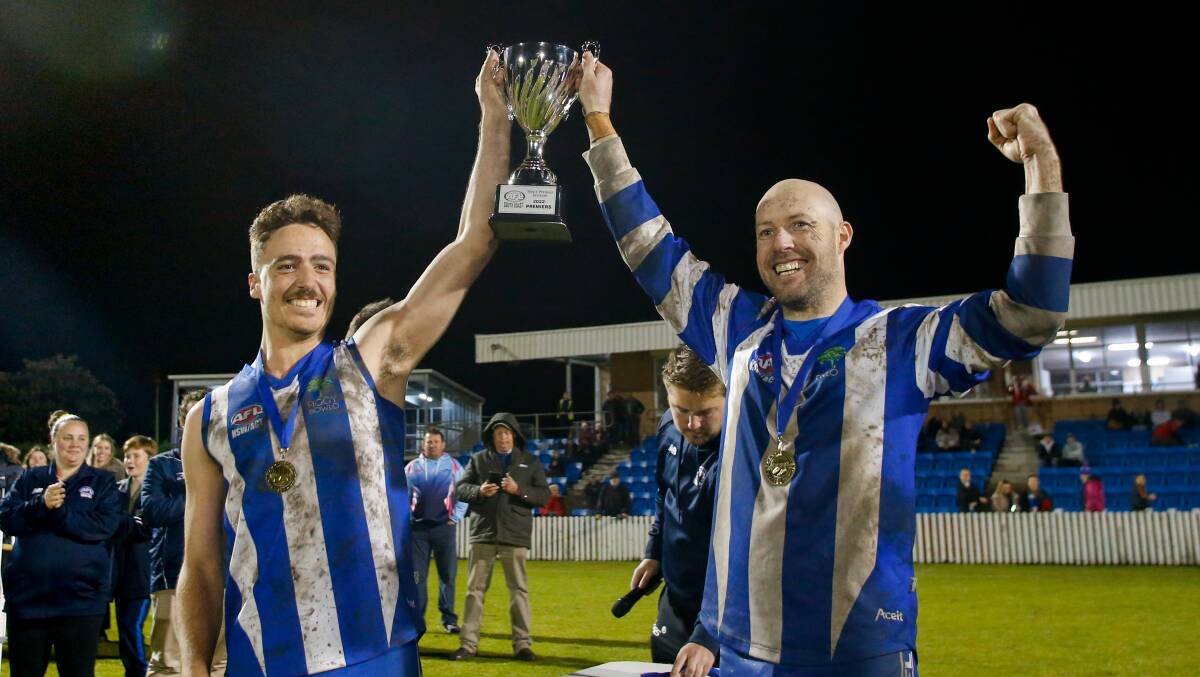 Figtree captain Jacob Hennessy and playing-coach Michael Coleman proudly hold the trophy aloft after last year's grand final. Picture by Anna Warr