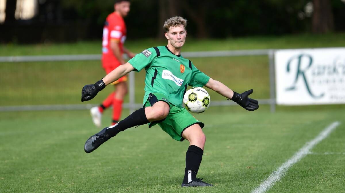 Goalkeeper Jake Charlston prepares to boot the ball while representing Wollongong United earlier this year. Picture by Richie Wagner