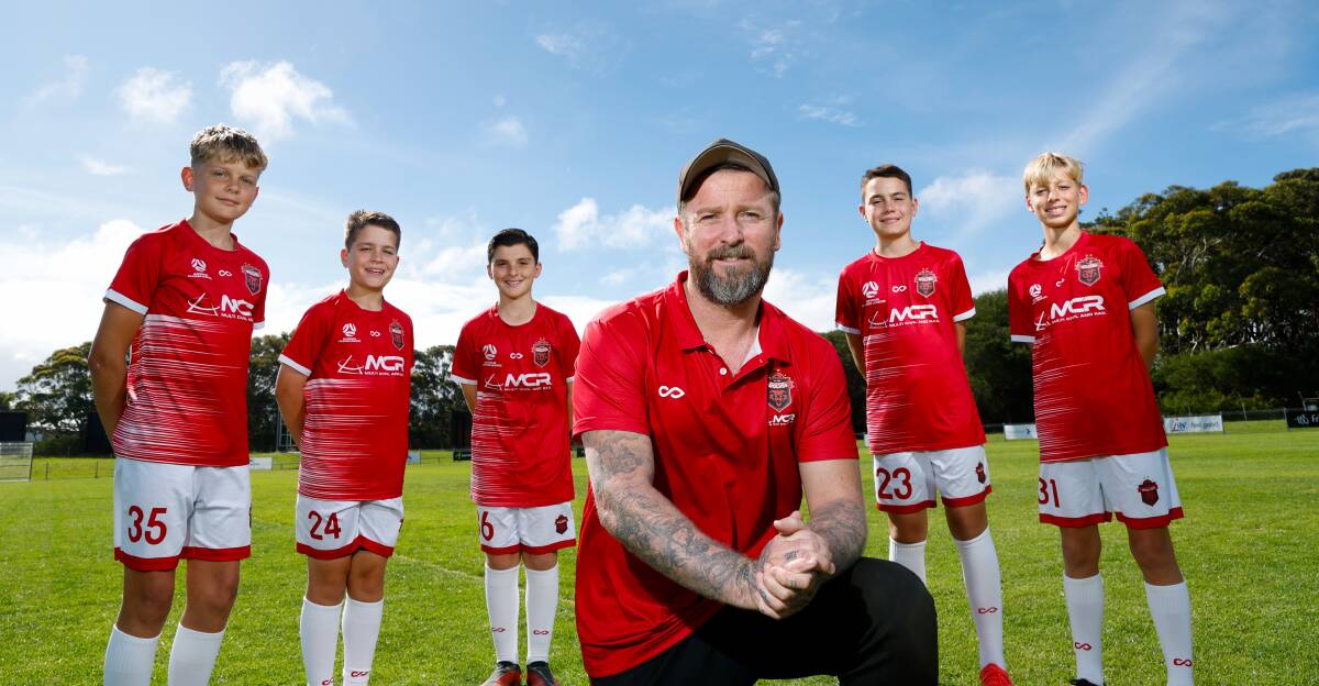 Wollongong Wolves head coach David Carney and the club's under-13s youth team players (from left) Luke Prouse, Logan Corbeski, Jett Ristevski, Chase Corbeski and Edward Page are excited about the new National Second Tier opportunity. Picture by Anna Warr