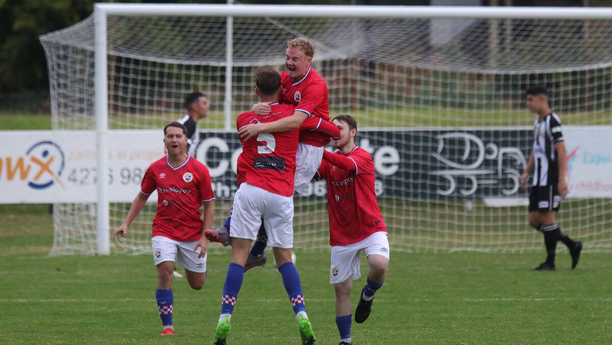 Lachlan Cook and his South Coast United teammates celebrate after scoring a goal against Port Kembla last year. Picture by Sylvia Liber