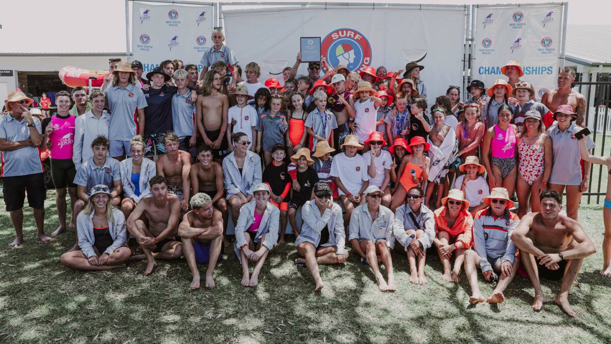 Warilla-Barrack Point Surf Life Saving Club members celebrate after being crowned NSW Country Champions on Sunday. Picture - SLSNSW