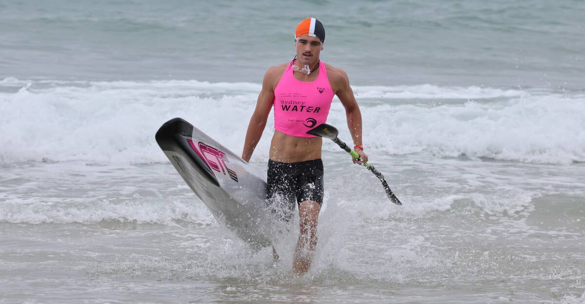 Warilla teenager Bailey Krstevski powers ahead during Saturday's Ironman event at Wollongong City Beach. Picture by Robert Peet