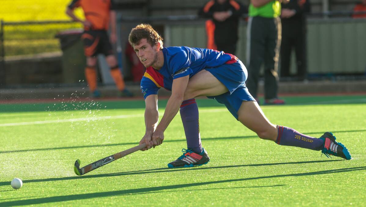 Tristan White in action for University in 2015 at the Unanderra Hockey Complex. Picture by Adam McLean