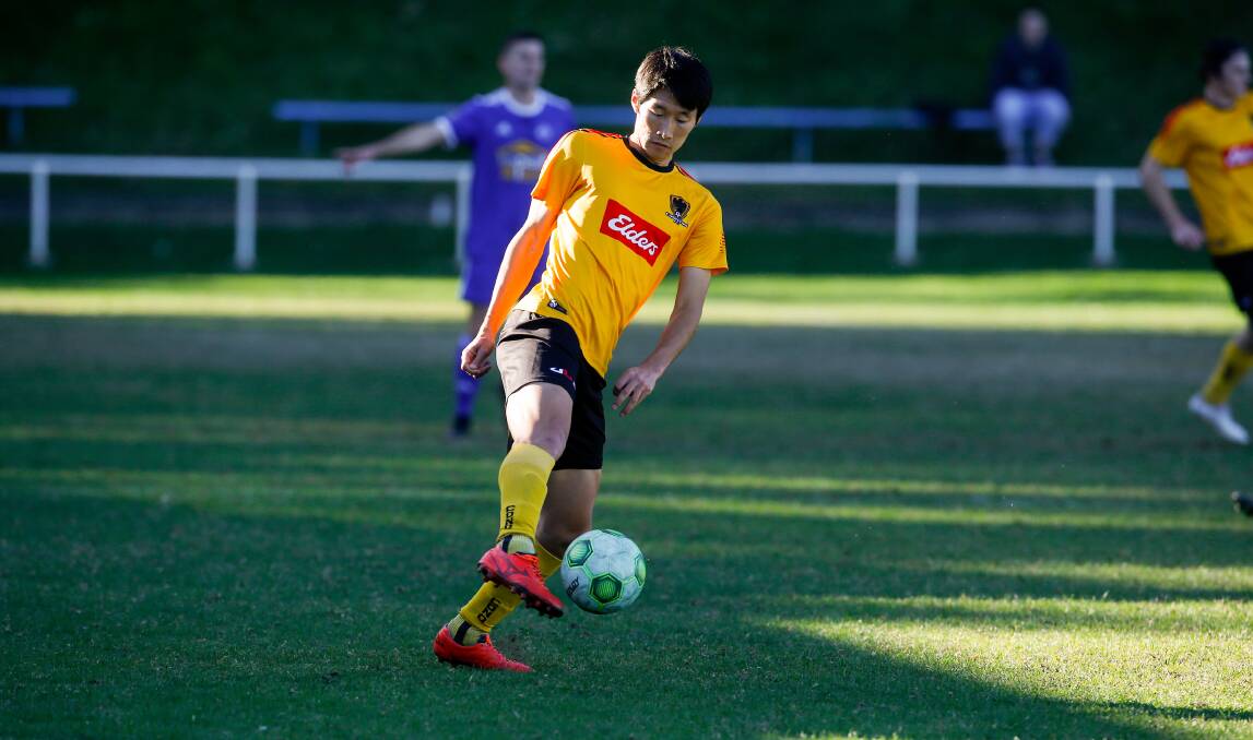Takayuki Kayano looks to control possession while representing Coniston against Bulli earlier this year. Picture by Anna Warr