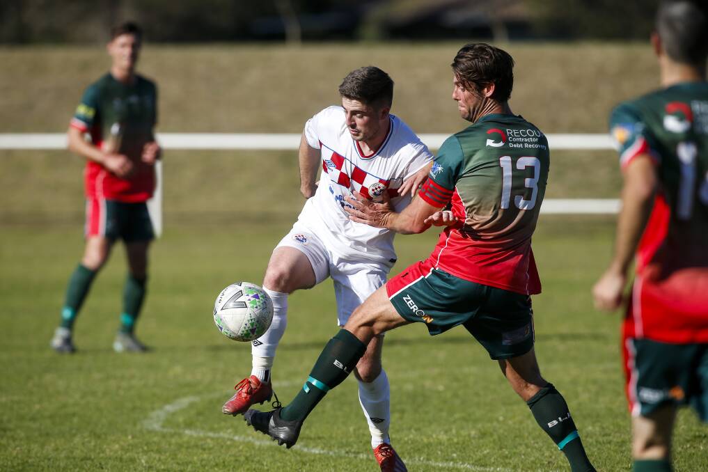 FOCUSED: South Coast United's Jamie Wakeling (left) shapes as a key figure for his Illawarra Premier League side in 2022. Picture: Anna Warr