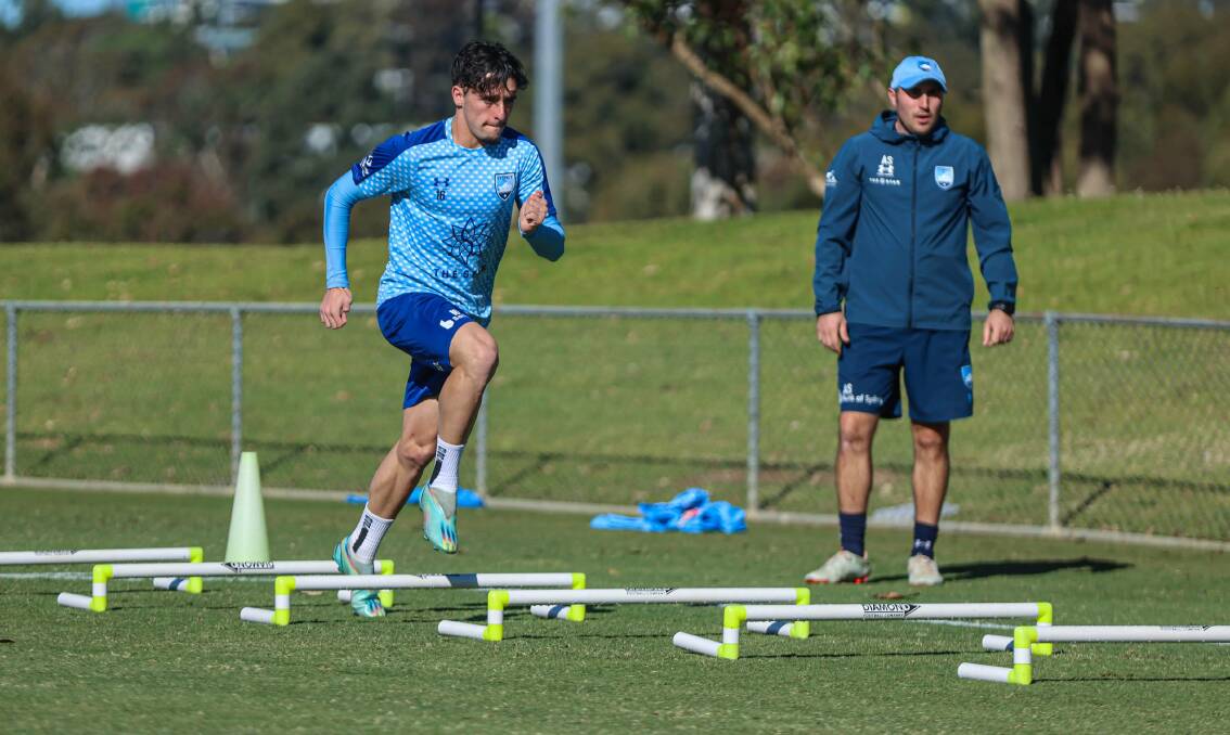 Dapto's Zac De Jesus is run through his paces at a Sydney FC training session recently. Picture - Sydney FC