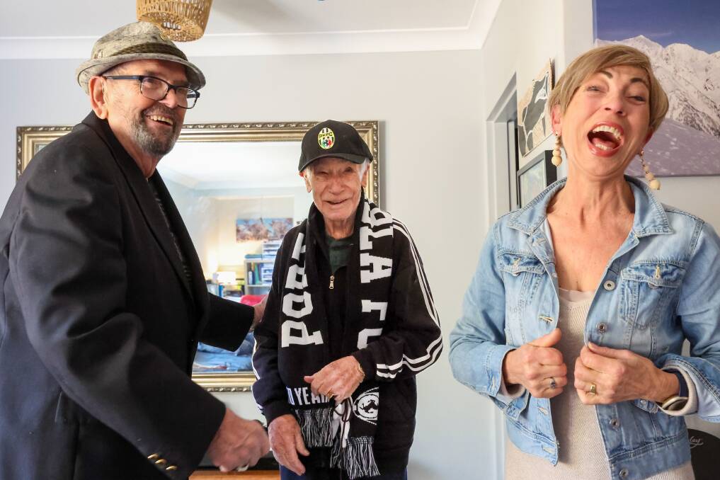 Sergio Napoleoni received Port Kembla Football Club paraphernalia from club stalwarts Albano and Maria Cazzolli. Picture by Adam Mclean.