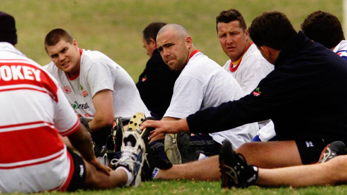 Shane Millard, centre, back in his 2002 playing days with the Dragons. Picture by Kirk Gilmour