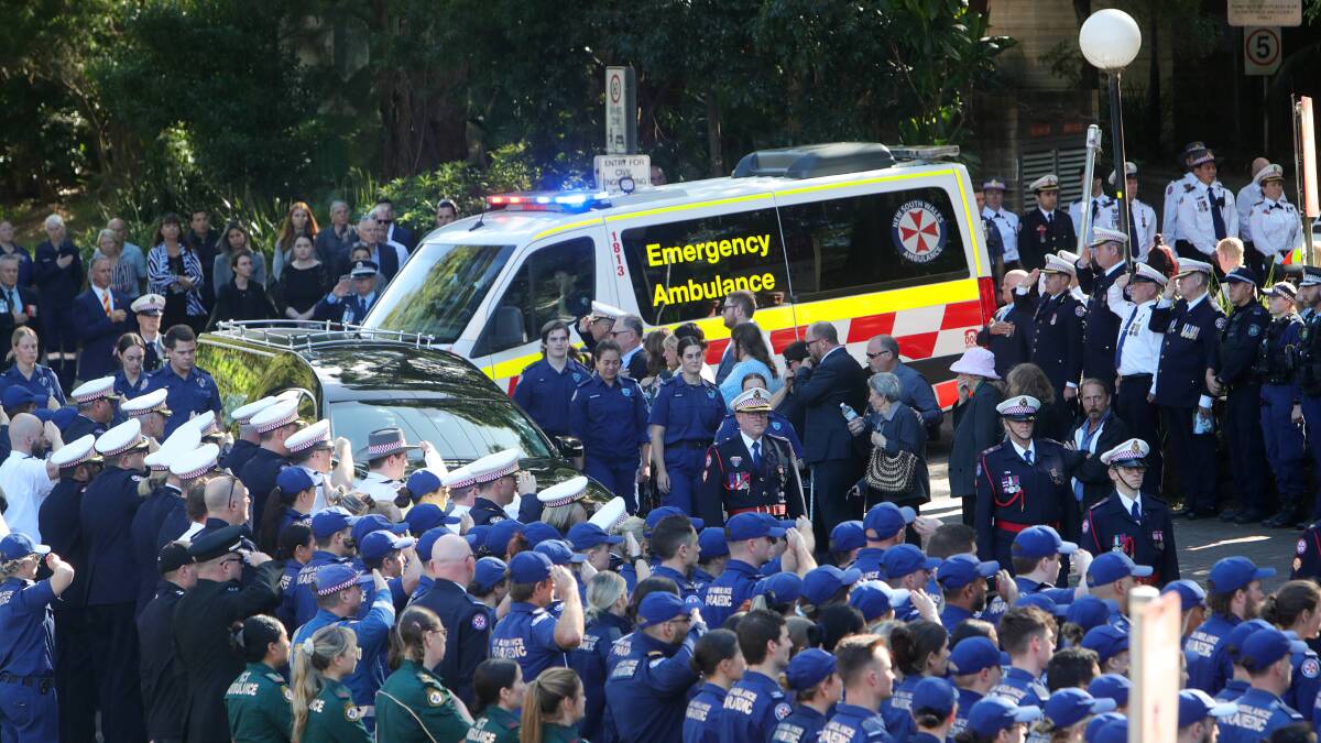 Illawarra Mercury photographers Sylvia Liber and Adam McLean were at UOW for the NSW paramedic's farewell. Extra photos via AAP.